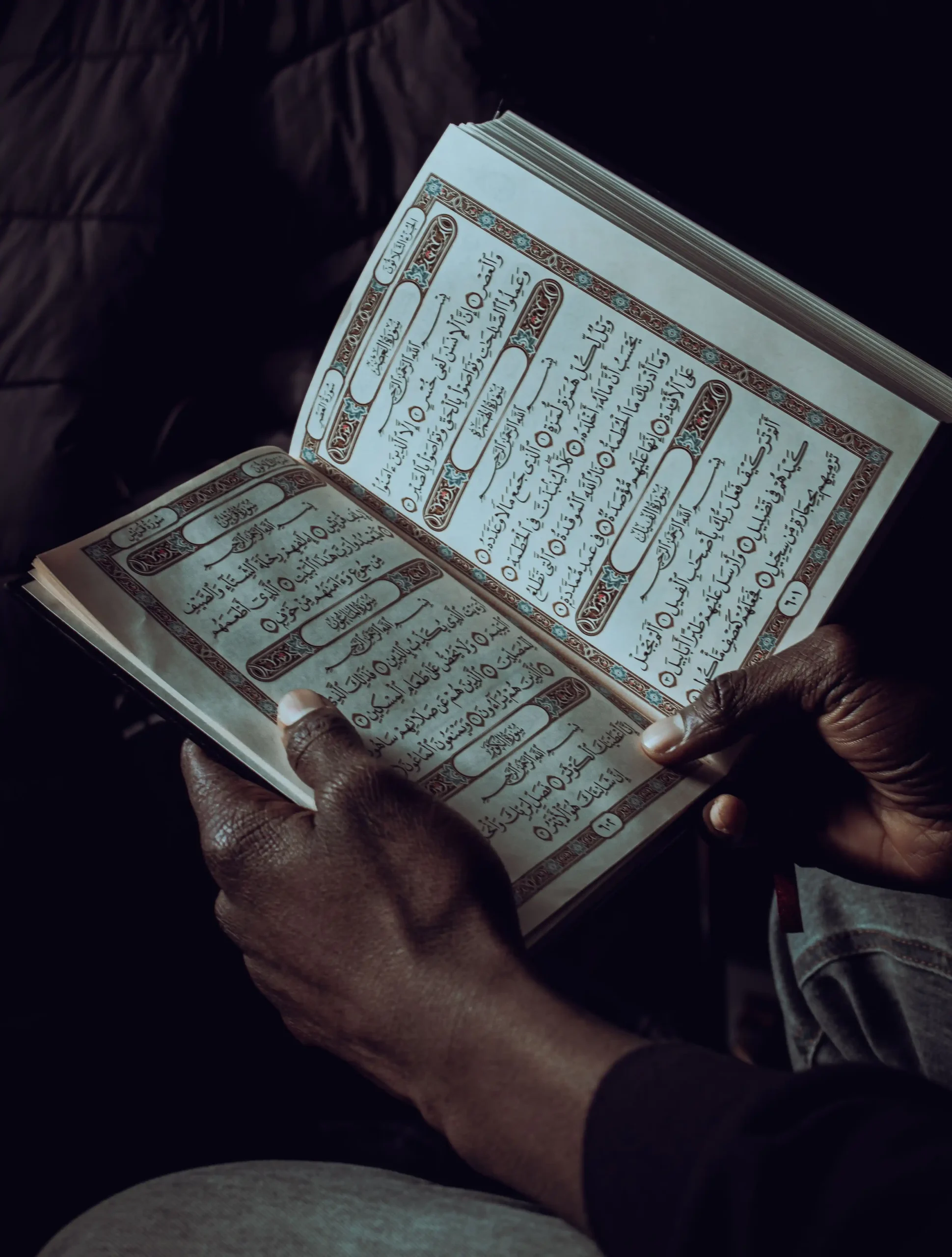 An adult learner reading the Quran privately