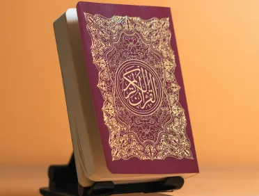 Quran displayed on a stand